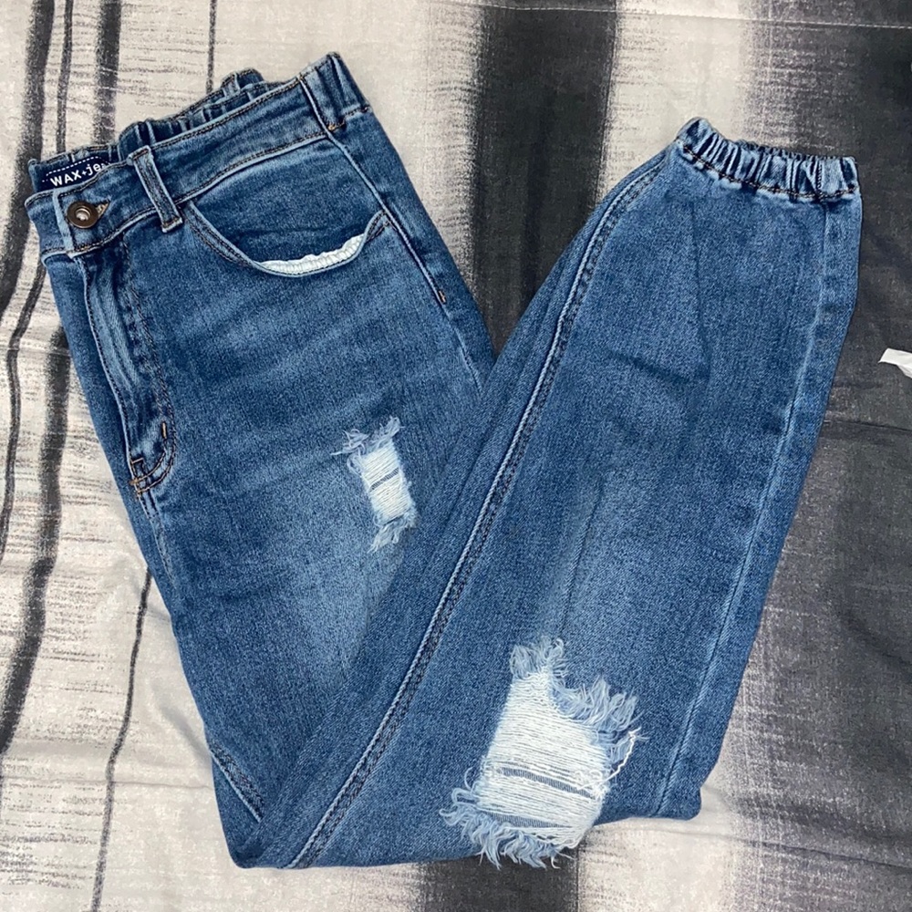 Large , blue ripped jeans , waistband stretches